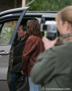 Victor Kerkhof has the music playing on Wayne's car system, wife Debra watches while groom Lieke videotapes the ride