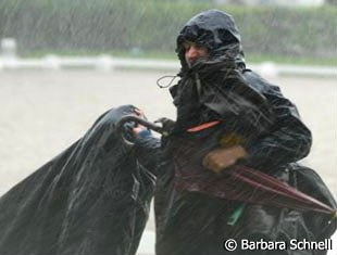 Groom runs inside, the rain has started