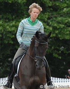 Nadine Capellmann and her new young Hanoverian mare. Capellmann wanted to test this 5-year-old black mare by Waterworld in show surroundings. A very interesting newcomer who has everything -- nerve and movements --except a name.