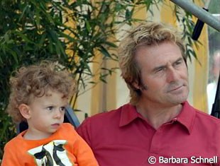 Yannick Janssen van Grunsven and his father Sjef Janssen watching mommy compete.