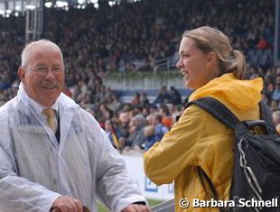 A journalist chatting with Manfred Heinrichsen, who's been the gate steward at Aachen for more than a decade.