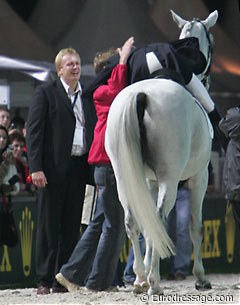 Andreas thrilled with his silver medal. He hugs Danish team trainer Rudolf Zeilinger. Esben Möller, manager of Blue Hors stud, watches and smiles.