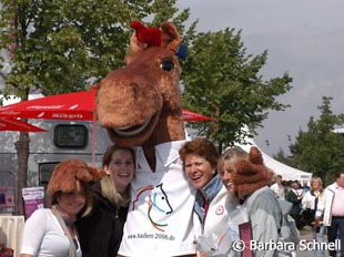 Some visitors posing with mascot Karli. Karli is so much more popular than Goleo, the lion macot of the soccer world cup