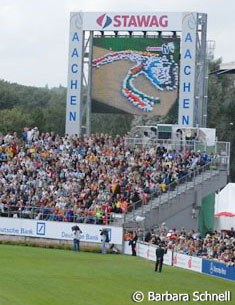 500 Kids in colourful T-shirts formed the WEG logo in the dressage arena