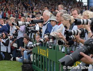 The hardest working people at the show under the worst conditions! Stuffed like sardines in a small box they can not leave under any circumstances! Pity the photographers who do all this for you!