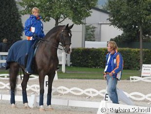 Anky van Grunsven practising the halt on Salinero. Sjef Janssen supervises