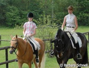 Carlotta Hassenburger on Dulcia and Lydia Camp on Jackpot head towards the warm up ring