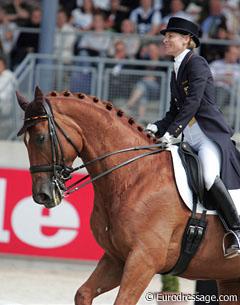Nadine Capellmann smiling on her horse Elvis VA, a rarity