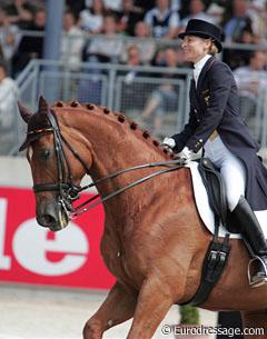 Nadine Capellmann smiling on her horse Elvis VA, a rarity