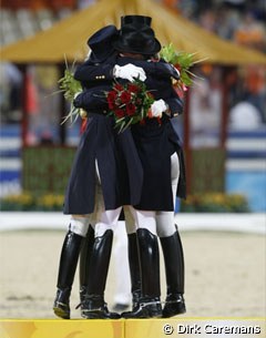 The gold medal winning German team: Werth, Kemmer and Capellmann hug :: Photo © Dirk Caremans