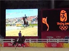 The jumbotron at the Equestrian Olympics from which the horses are spooking