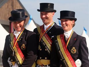 Grand Prix riders' podium: Claudia Fassaert (silver), Jeroen Devroe (gold), Fanny Verliefden (bronze)