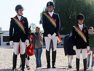 FEI Pony riders podium: Geoffrey de Roy (silver), Noemie Goris (gold), Leyla Larsson (bronze)