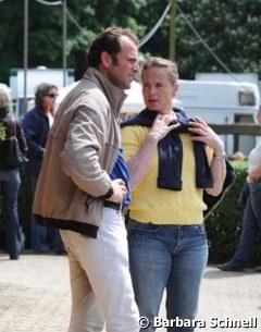 Isabell Werth watching a test with Heiner Schiergen