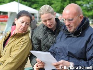Gaby Winkelhues and Desiree & Adolf Theo Schurf (owner of Dressman) study the start list.