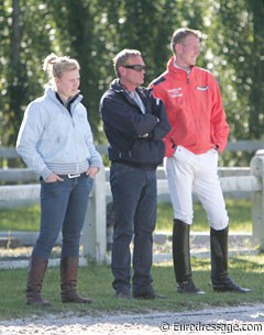 The Van Silfhout family watching one of their students ride: Jarissa, father Alex, and Diederik