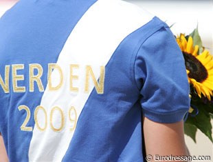 The flower girls wear a nice polo during the award ceremony