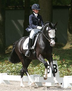 The petite Fabienne Claeys has a great schoolmaster in Domino