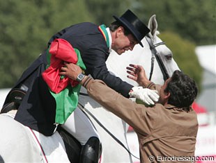 Brothers Carlos and Daniel Pinto give each other a hug after Carlos' ride.