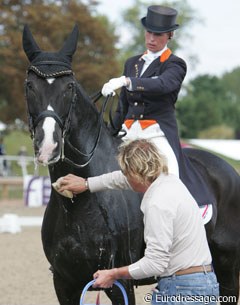 Helping hands: Sjef Janssen sponging Anky's Salinero before their Special test.