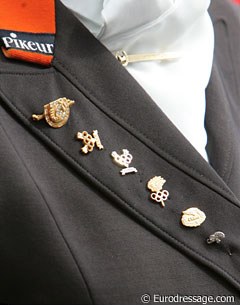 Anky van Grunsven's lapel. Olympic pins of the triple Olympic champion