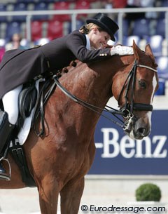 Julie is ecstatic about her ride and pats Fazzino