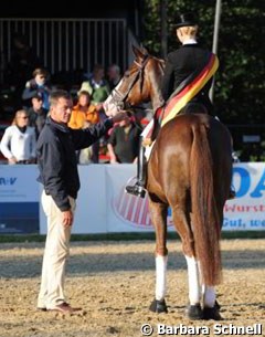Eva Möller and Blickpunkt win the 6-year old Dressage Horse Division at the 2010 Bundeschampionate. Husband Ulf holding the horse :: Photo (c) Barbara Schnell