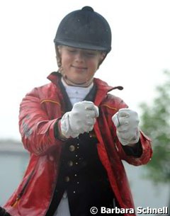 Jessica Krieg wrings water from her gloves