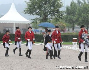 The Young Riders' lap of honor without horses (because of the rain)