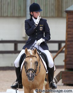 Nail biting moments for the German team as last rider Katharina Weychert leaves the arena with Golden Derano C