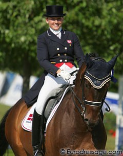 Danish Nanna Skodborg Merrald has a big smile during the prize giving. She finished 8th aboard Millibar (by Milan) with 70.263%
