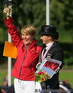 Charlott Maria Schurmann and her mom on the podium. Her mom received a trophy for being the groom of the gold medal winning horse