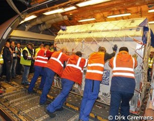 The last container is being loaded before the flight