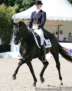 Julia Funke, daughter of major show organiser Kaspar Funke, on Heinrich Klatte's Hanoverian stallion Dr. Doolittle (by Donnerhall x Lauries Crusador xx)