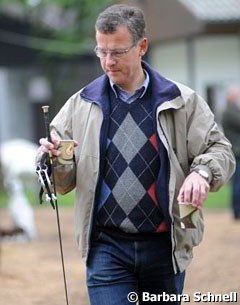 Bianca Nowag's father carrying the essential "stimulants": whip, spurs and two cups of coffee