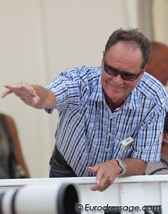 Andreas' father Ulf Helgstrand (president of the Danish Equestrian Federation) waves to a friend