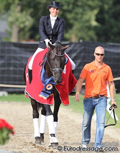 Emmelie Scholtens and boyfriend Jeroen Witte (son of horse dealer Nico Witte) guide Astrix to the show ring for the prize giving ceremony