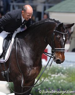 An ecstatic Steffen Peters gives Ravel a pat