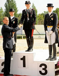 The 2011 Italian Grand Prix podium: Scolari, Truppa and Rustignoli. FISE Dressage Director David Holmes congratulates Truppa :: Photo © Marco Villanti