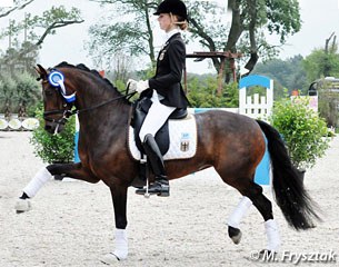 Grete Linnemann and Cinderella finish fourth in the Kur to Music after winning Individual test gold at the 2011 European Pony Championships