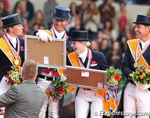 Laura B has a laugh with the prize picture each rider got on the podium