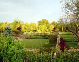All gardens are landscaped. This one has a view on the pastures in the background