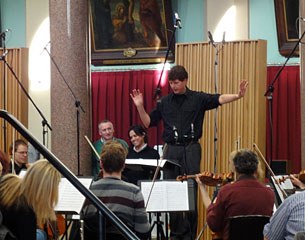 Britain’s Olympic dressage rider Richard Davison and arranger Joost Peters from Holland listen to the Royal Liverpool Philharmonic Orchestra recording the new Robbie Williams freestyle