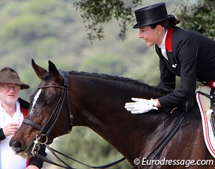 Nora pats Milan at the finish of her test