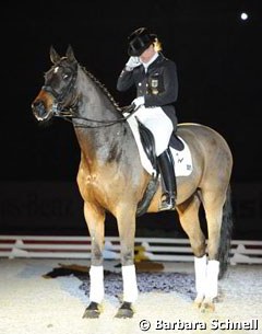 Isabell Werth in tears during Satchmo's retirement ceremony at the 2011 CDI Stuttgart :: Photo © Barbara Schnell