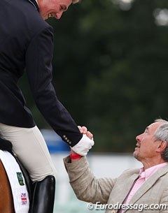 Michael Eilberg and Farouche's owner Dave Crowden shake hands and celebrate the victory