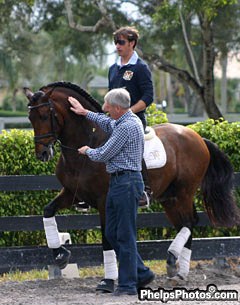 Jan Bemelmans works with Spanish rider Daniel Martin Dockx and Grandioso III at Hampton Green Farm, Wellington, Florida :: Photo © Alex Zilo