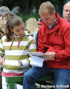 Charlotte Maria Schurmann and her trainer Oliver Oelrich looking at the order of go