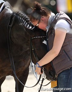 Nathalie zu Sayn-Wittgenstein's groom Benedicte Stine Olsen cuddling Digby