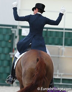 Monica Theodorescu balls her fists when she sees her winning score flash on the board